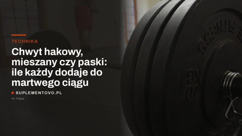 Talerze i zacisk na gryfie sztangi w siłowni
