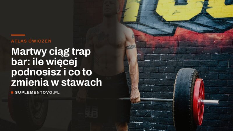 Mężczyzna trzyma prostą sztangę obciążoną oponami przed martwym ciągiem